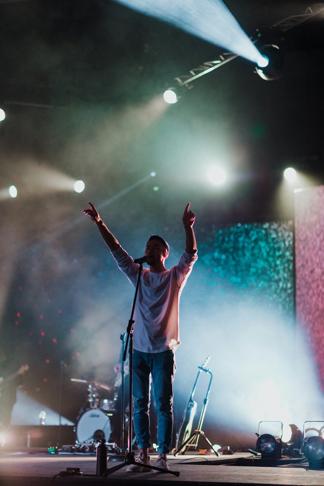 Uruguayan singer performing on stage with a microphone